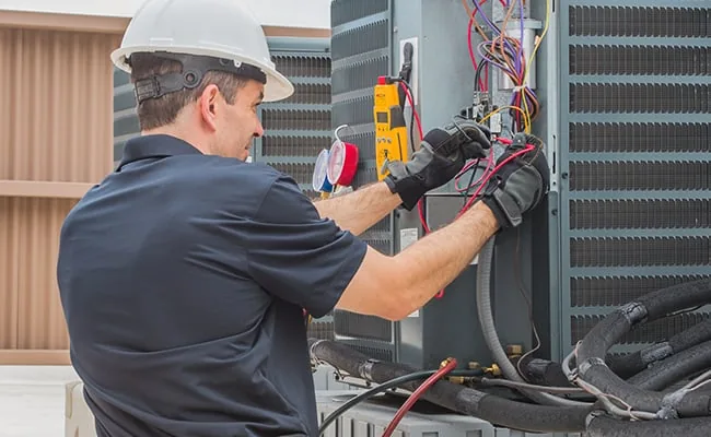 Representative image of urgent electrical service on outdoor HVAC equipment